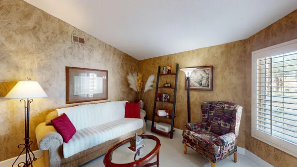 a living room with furniture and a window