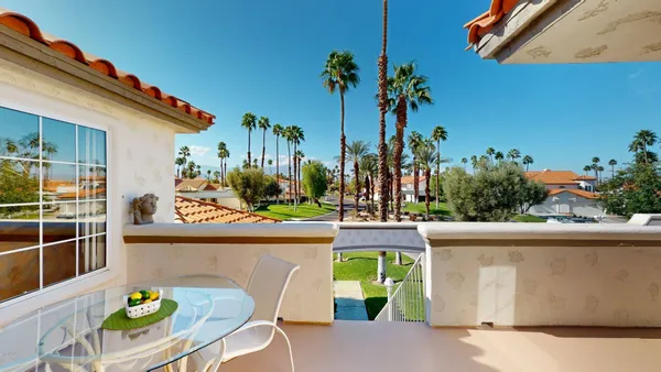 a kitchen with a table and chairs in it