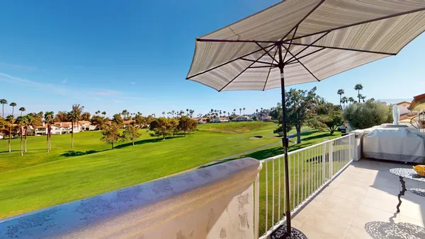 a view of two chairs in balcony