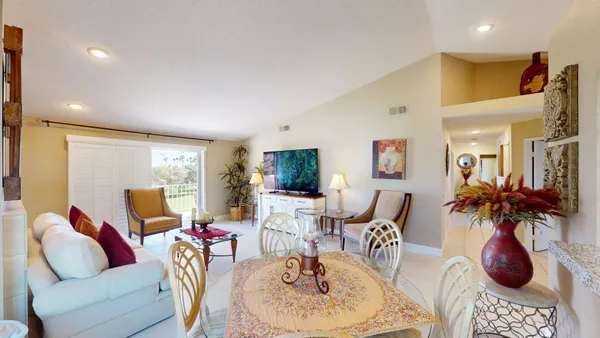 a living room with furniture and a table