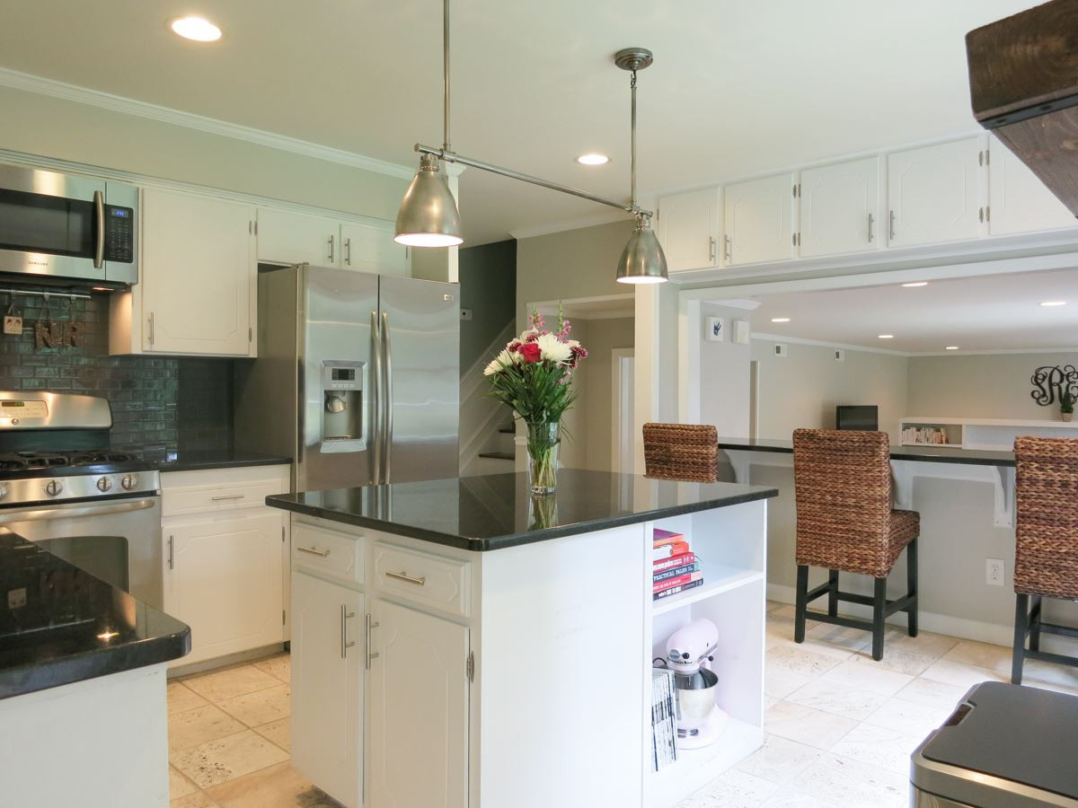 912 Hardimont Road Raleigh, NC 27609 - Photo 10 of 25 This view of the fabulous Kitchen shows the eat-at bar overlooking the Family Rm 3 steps below. Kitchen