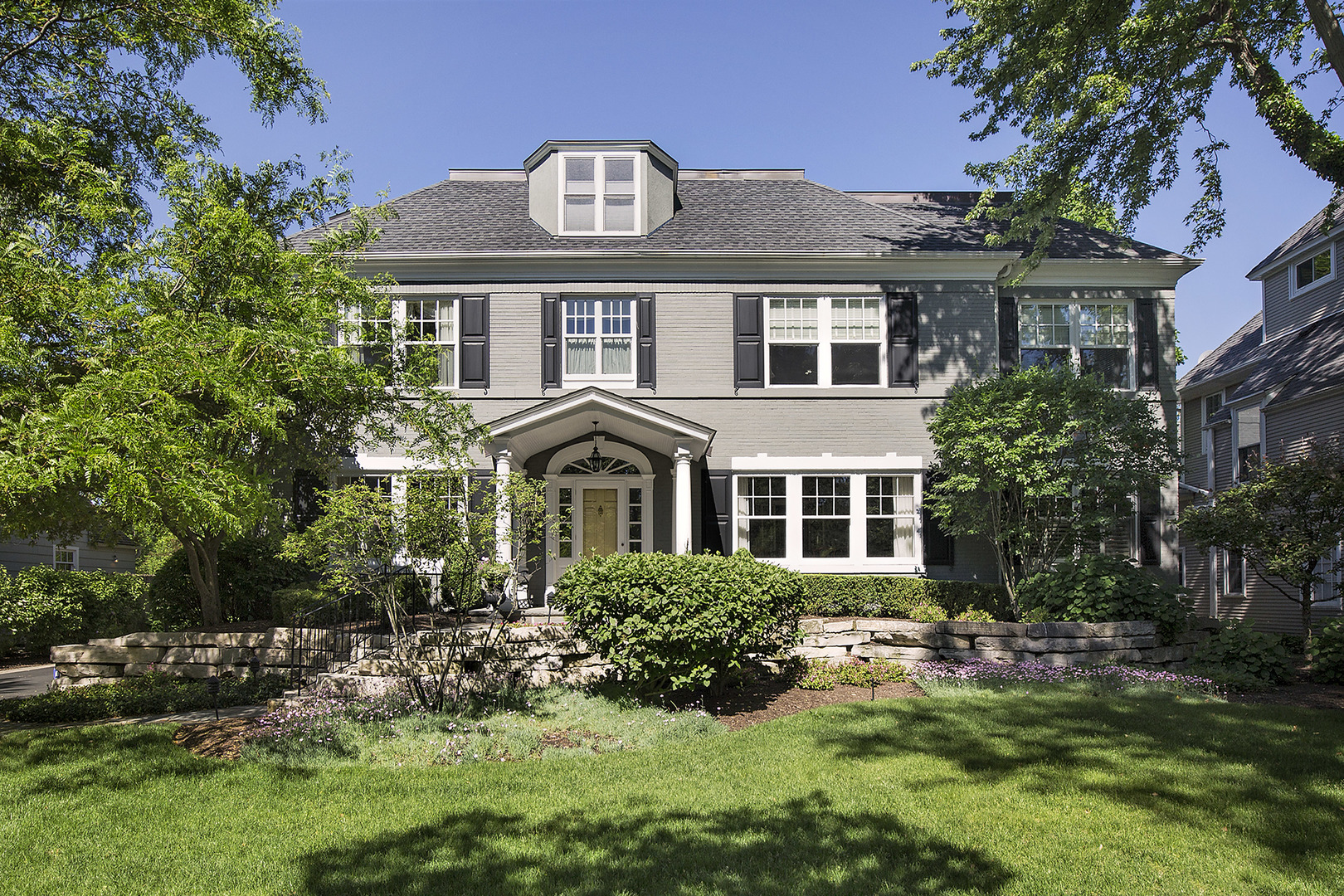 268 Ridge Avenue Winnetka, IL 60093 - Photo 1 of 26 a front view of a house with a yard