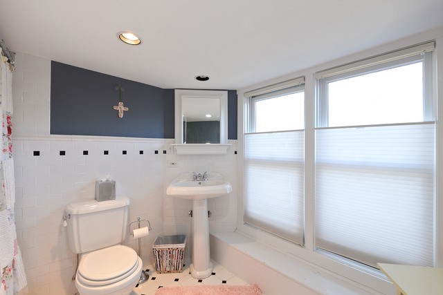 268 Ridge Avenue Winnetka, IL 60093 - Photo 19 of 26 a bathroom with a toilet a sink and a window
