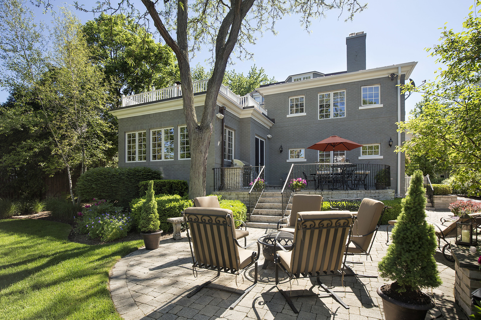 268 Ridge Avenue Winnetka, IL 60093 - Photo 25 of 26 a view of a patio with table and chairs and potted plants