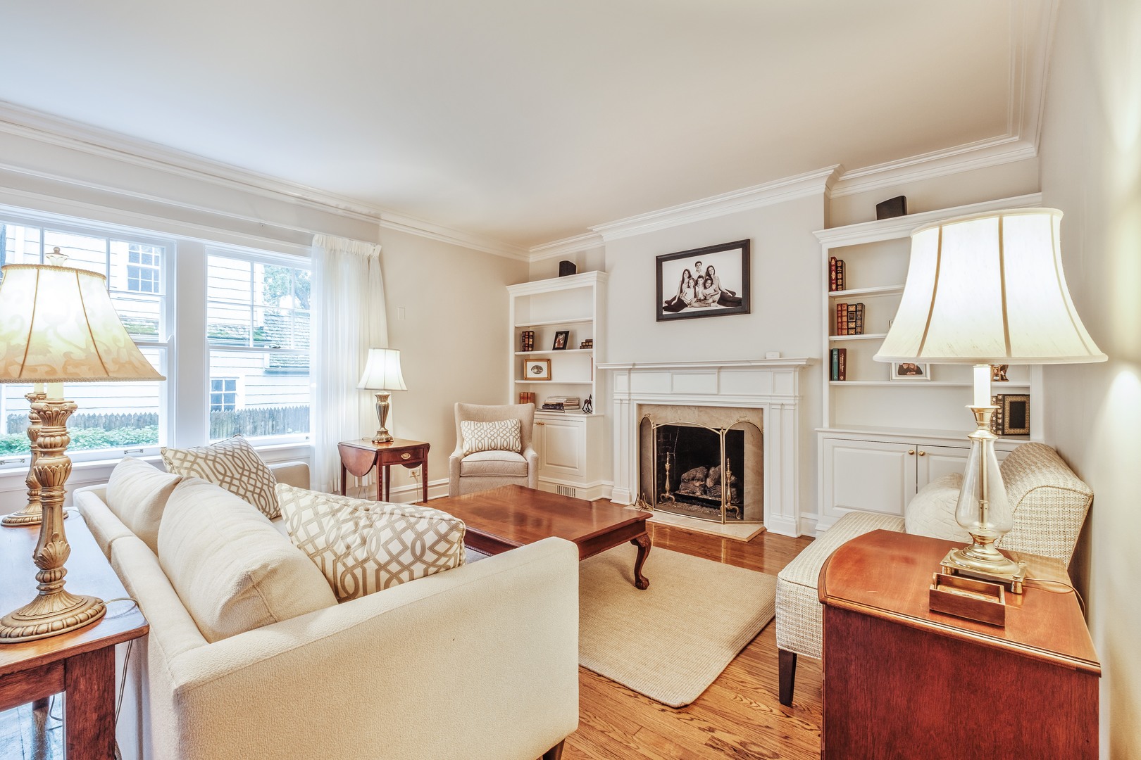 268 Ridge Avenue Winnetka, IL 60093 - Photo 4 of 26 a living room with furniture a fireplace and a large window