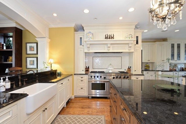 268 Ridge Avenue Winnetka, IL 60093 - Photo 7 of 26 a large kitchen with stainless steel appliances granite countertop a stove and a sink
