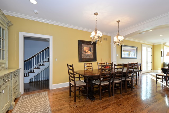 268 Ridge Avenue Winnetka, IL 60093 - Photo 10 of 26 a view of a dining room and livingroom with furniture wooden floor a chandelier