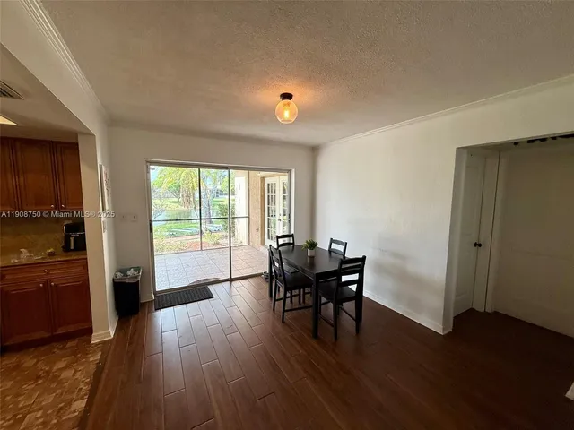 a view of a livingroom with furniture and wooden floor
