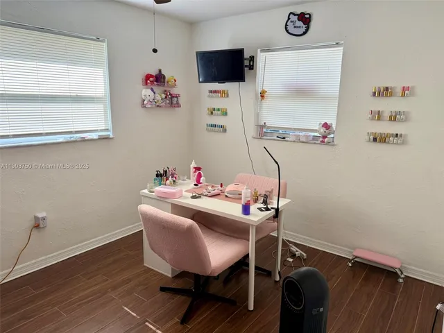 a dining room with table and chairs