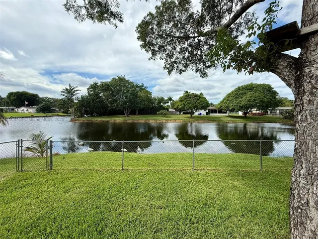 a view of a lake with a bench and a lake view