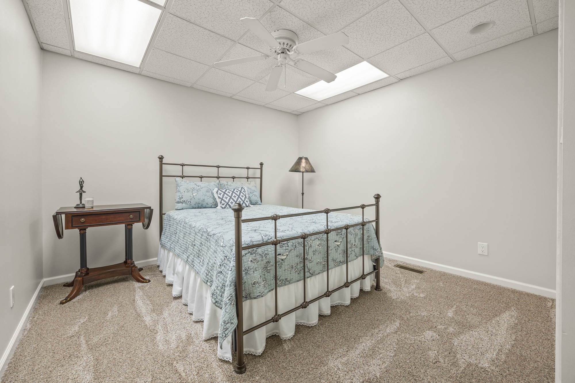998 Highland Trail Sparta, TN 38583 - Photo 17 of 43 a bedroom with a bed and a chandelier
