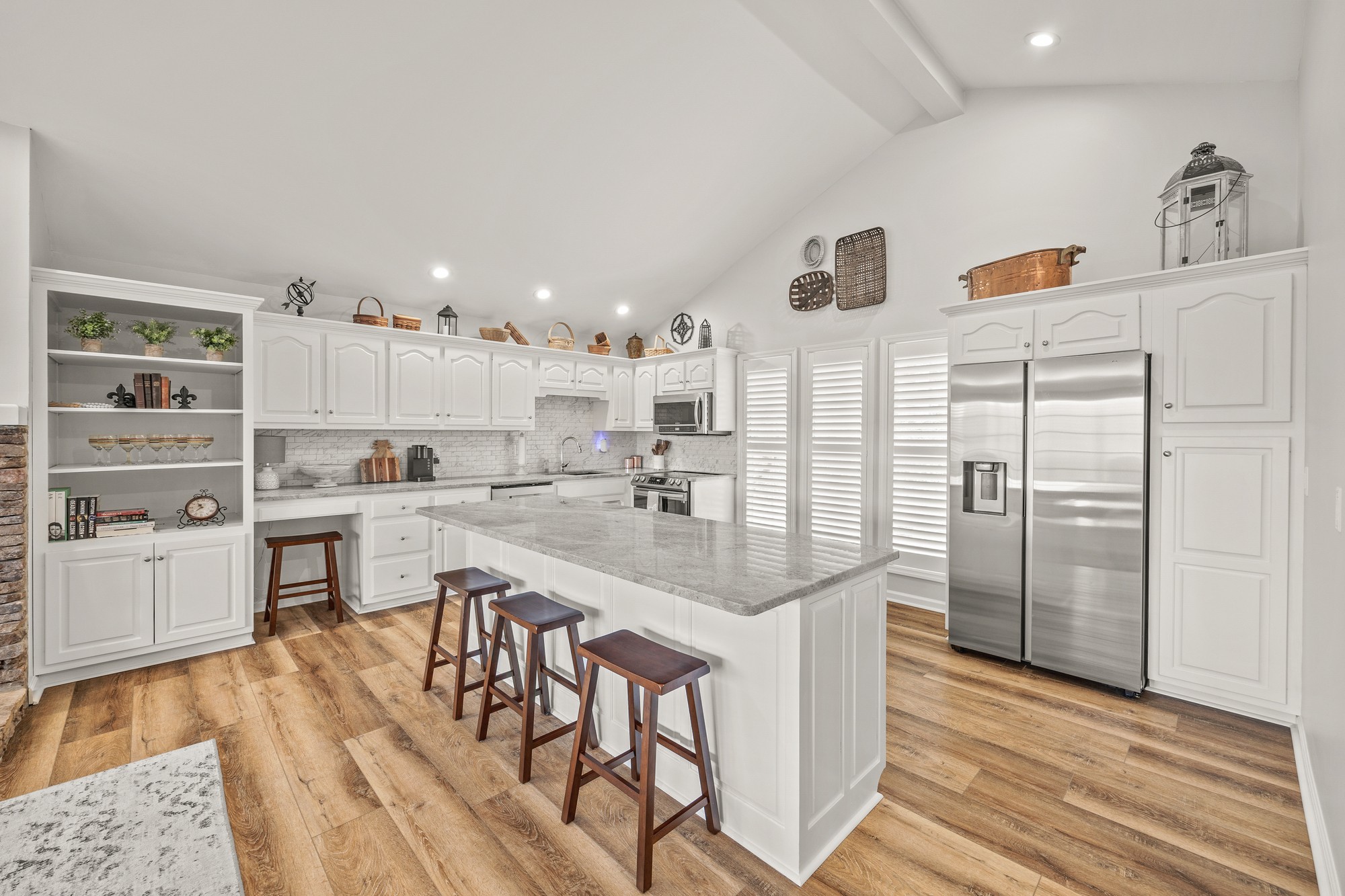 998 Highland Trail Sparta, TN 38583 - Photo 8 of 43 a kitchen with white cabinets and stainless steel appliances