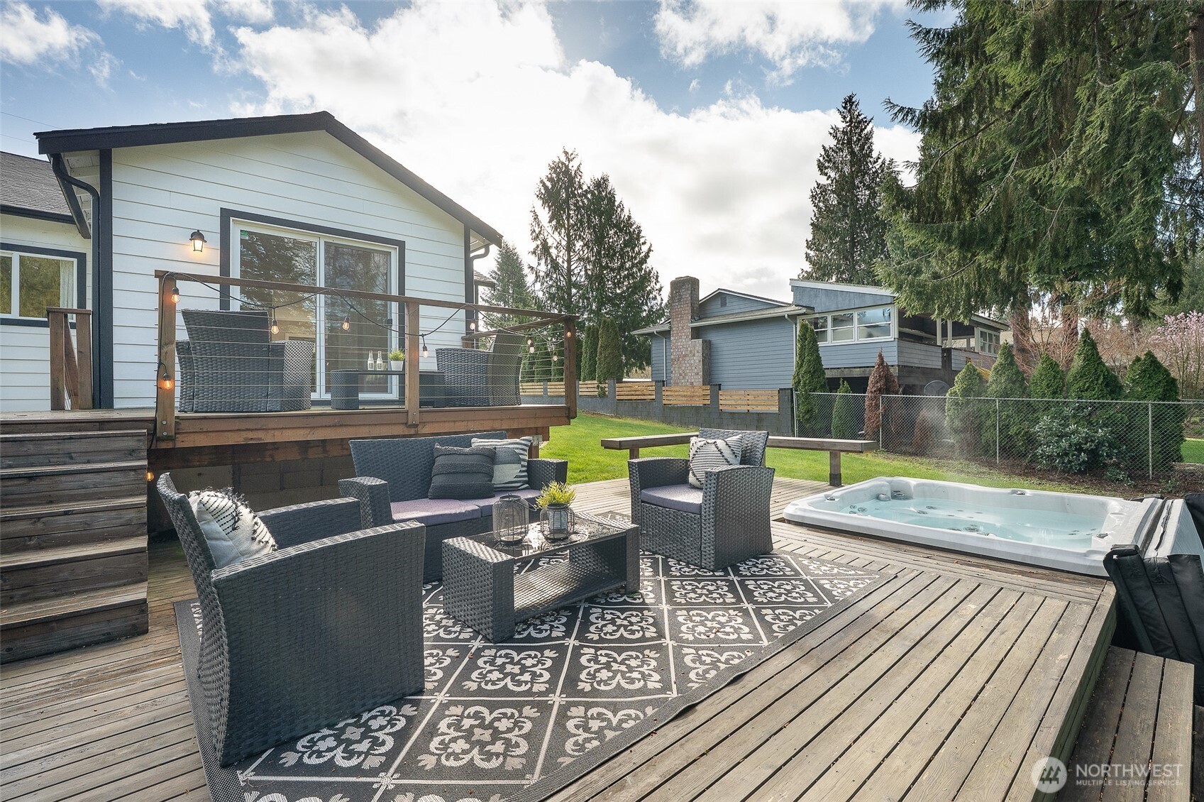 18824 80th Avenue West Edmonds, WA 98026 - Photo 13 of 35 a view of a patio with couches table and chairs and potted plants