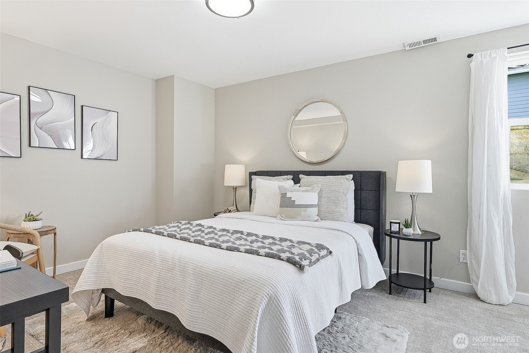 18824 80th Avenue West Edmonds, WA 98026 - Photo 24 of 35 a bedroom with a bed and wooden floor