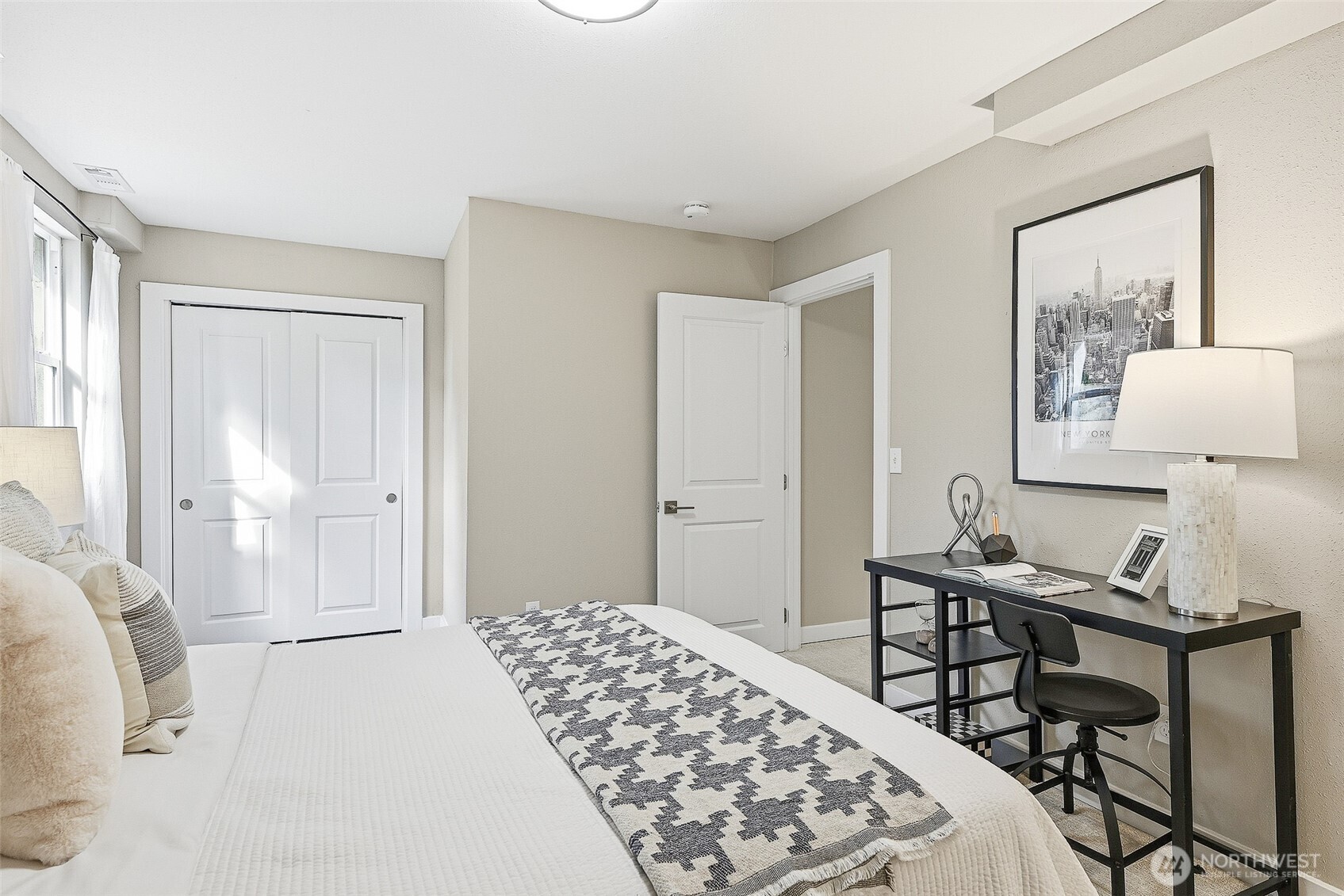 18824 80th Avenue West Edmonds, WA 98026 - Photo 25 of 35 a bedroom with a bed and a table in it