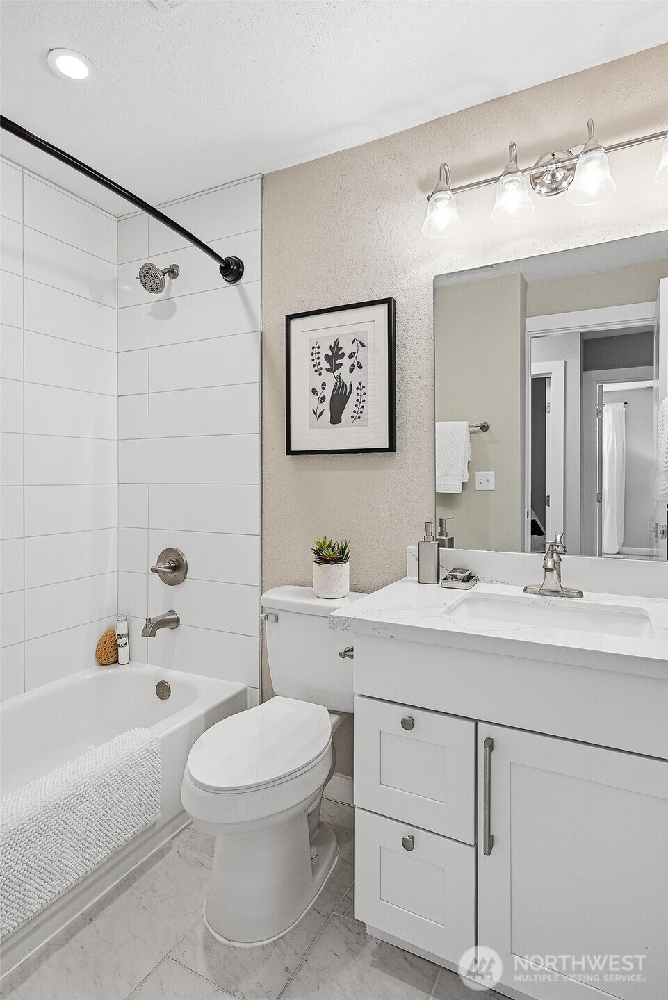 18824 80th Avenue West Edmonds, WA 98026 - Photo 26 of 35 a bathroom with a toilet a sink a mirror a bathtub and vanity