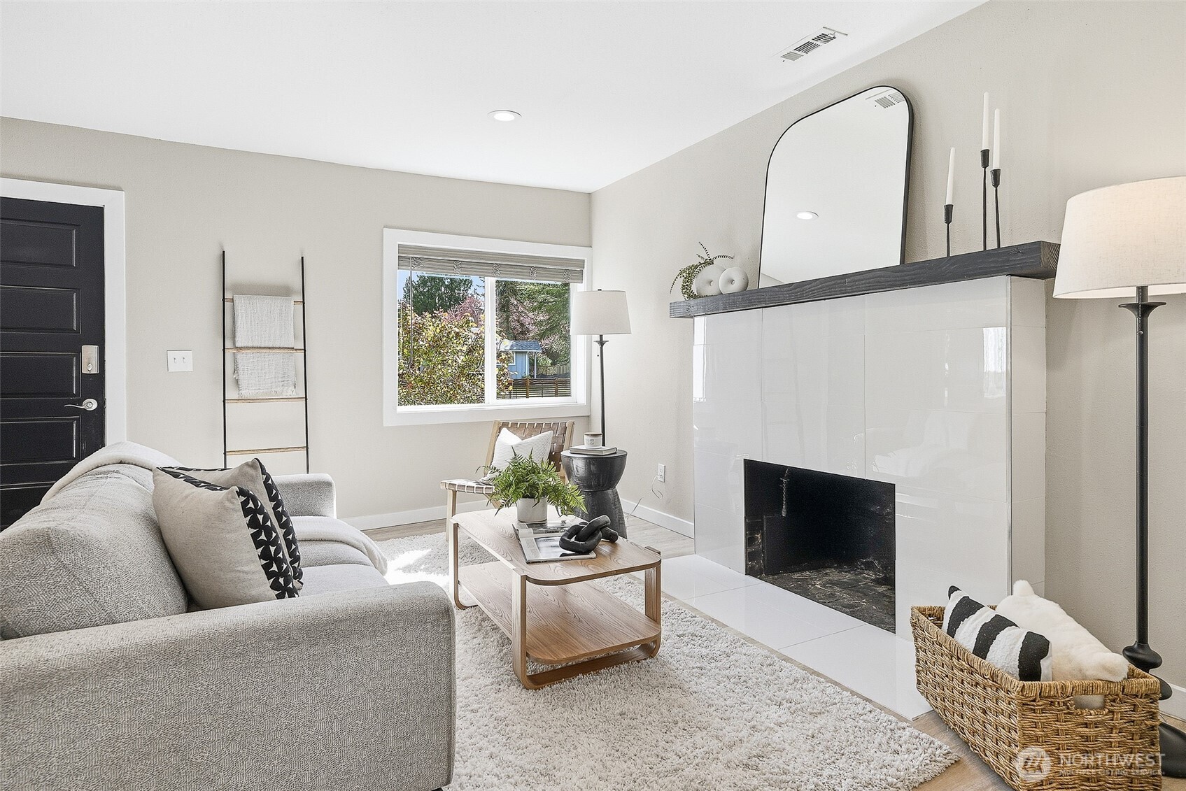 18824 80th Avenue West Edmonds, WA 98026 - Photo 3 of 35 a living room with furniture a window and a fireplace