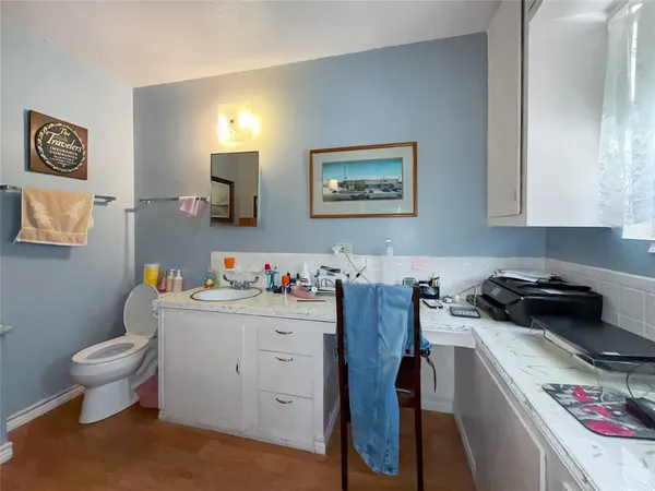 a bed room with furniture and a flat screen tv