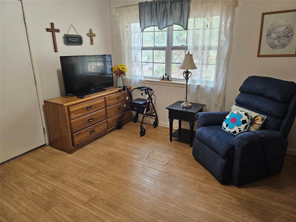3200 Donna Road Denton, TX 76207 - Photo 38 of 40 a living room with furniture and a flat screen tv