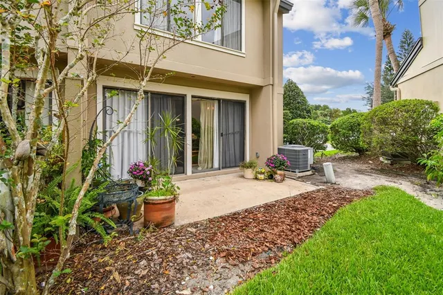 a view of a backyard with sitting area