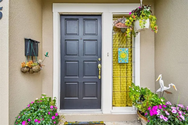 a vase of flowers sitting on a floor