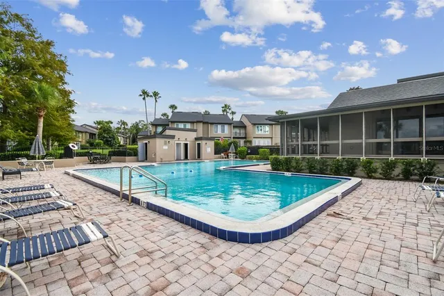 a view of a house with swimming pool