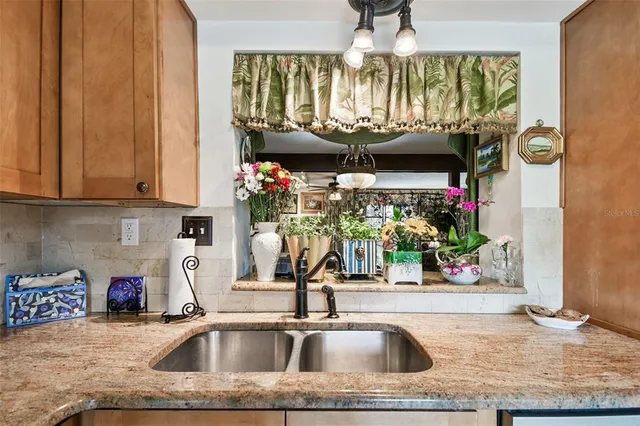 a kitchen with a sink and a microwave