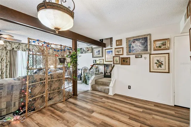 a view of a livingroom with furniture and a large window