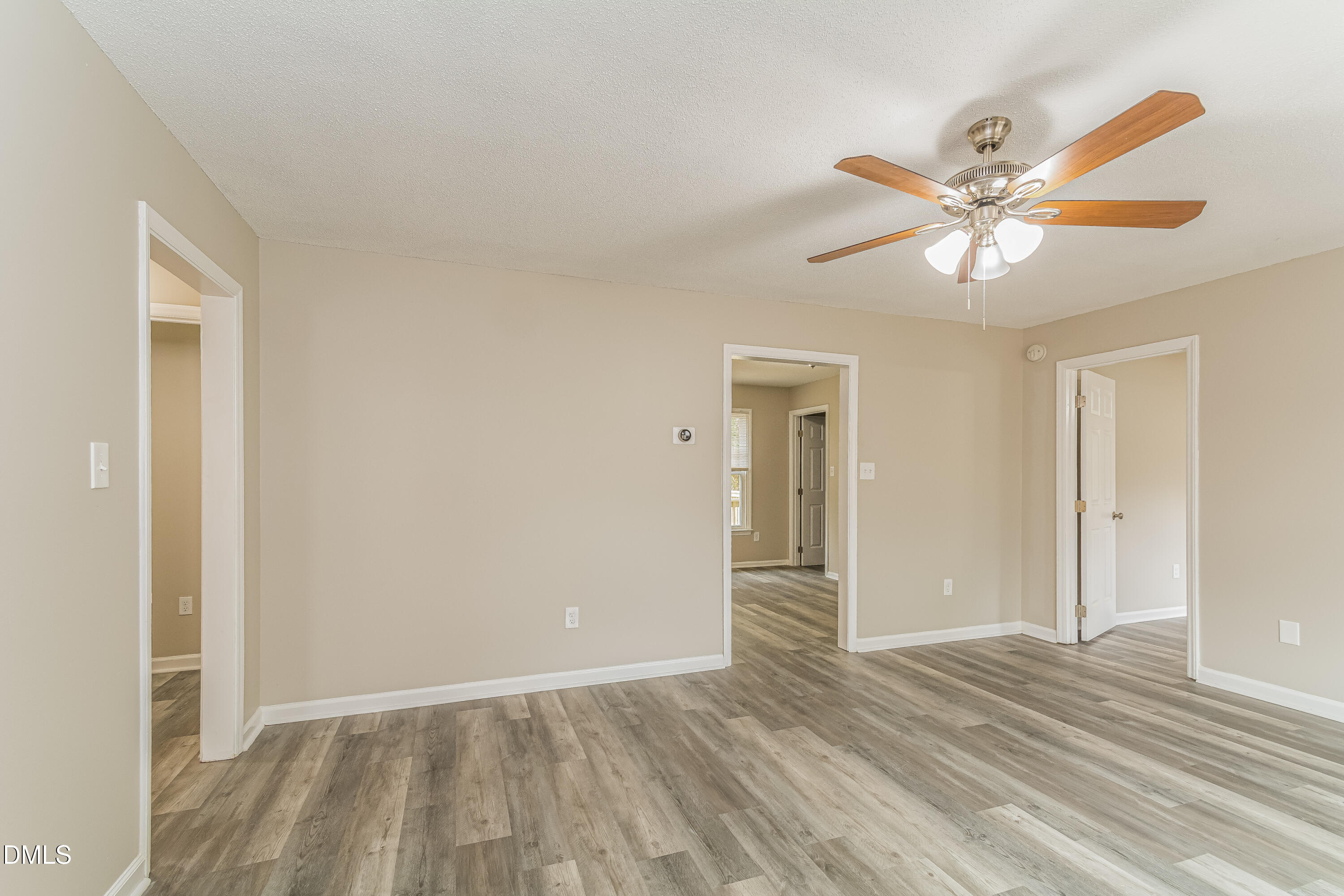 617 Bartlett Road Fuquay-Varina, NC 27526 - Photo 2 of 16 a view of a livingroom with a ceiling fan and window