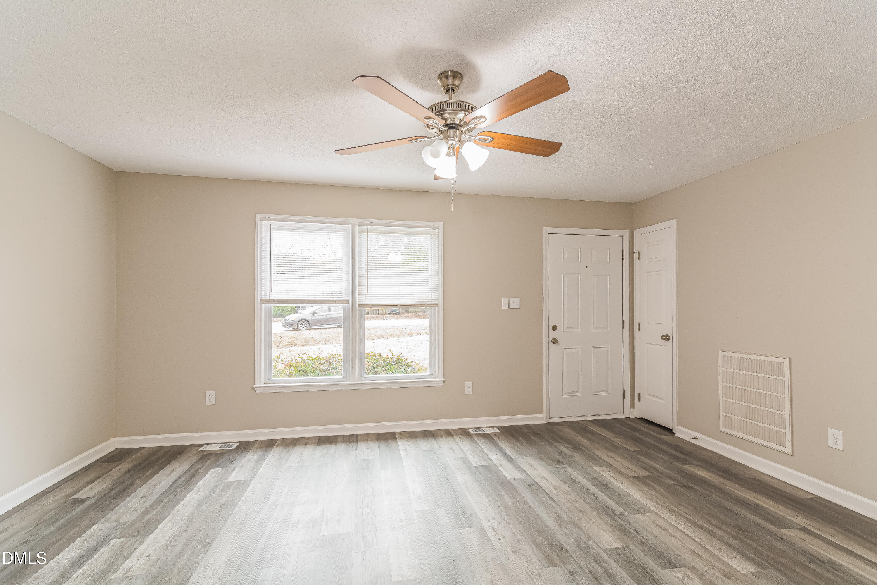 617 Bartlett Road Fuquay-Varina, NC 27526 - Photo 3 of 16 wooden floor in an empty room with a window
