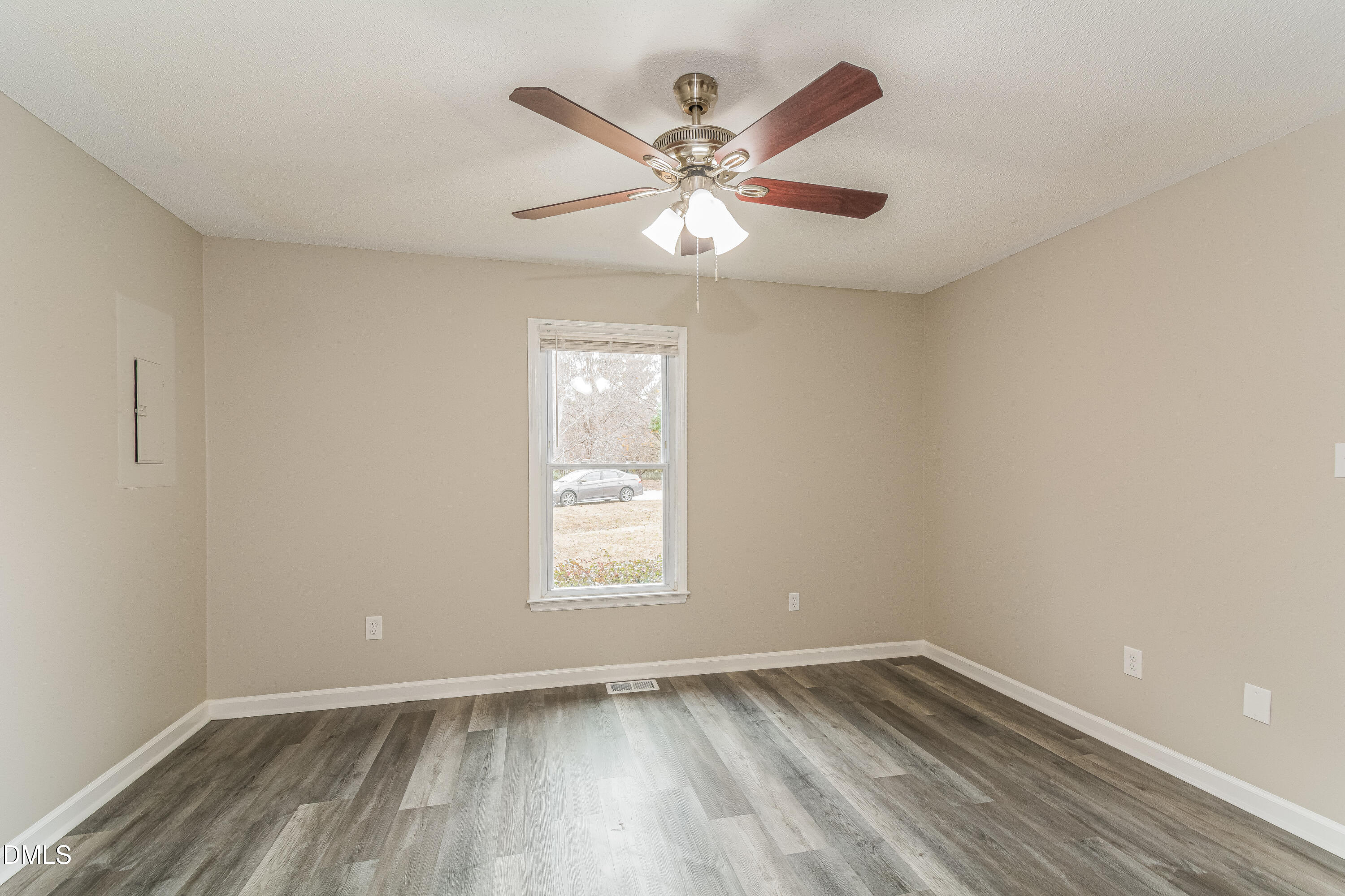 617 Bartlett Road Fuquay-Varina, NC 27526 - Photo 7 of 16 wooden floor in an empty room with a window