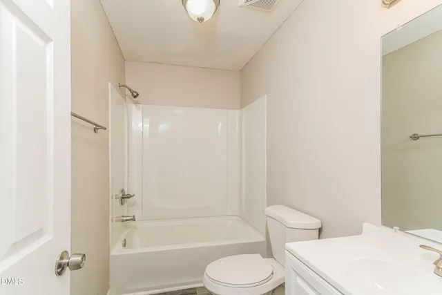 a bathroom with a toilet a sink and a bathtub