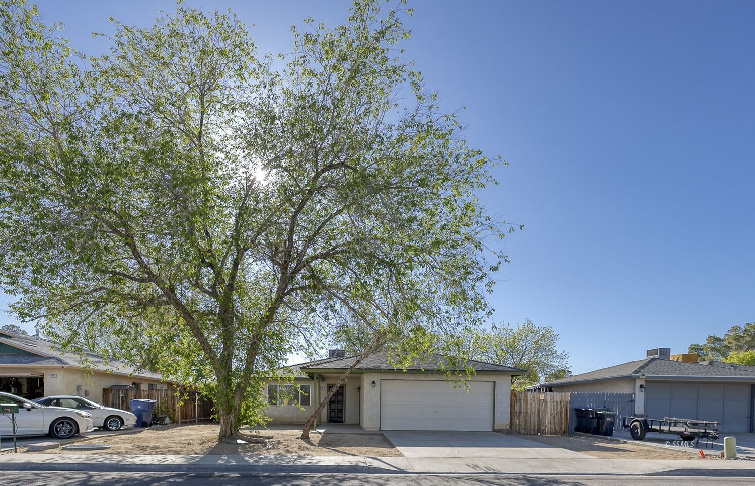 413 South Lincoln Street Ridgecrest, CA 93555 - Photo 26 of 34 a front view of a building with trees