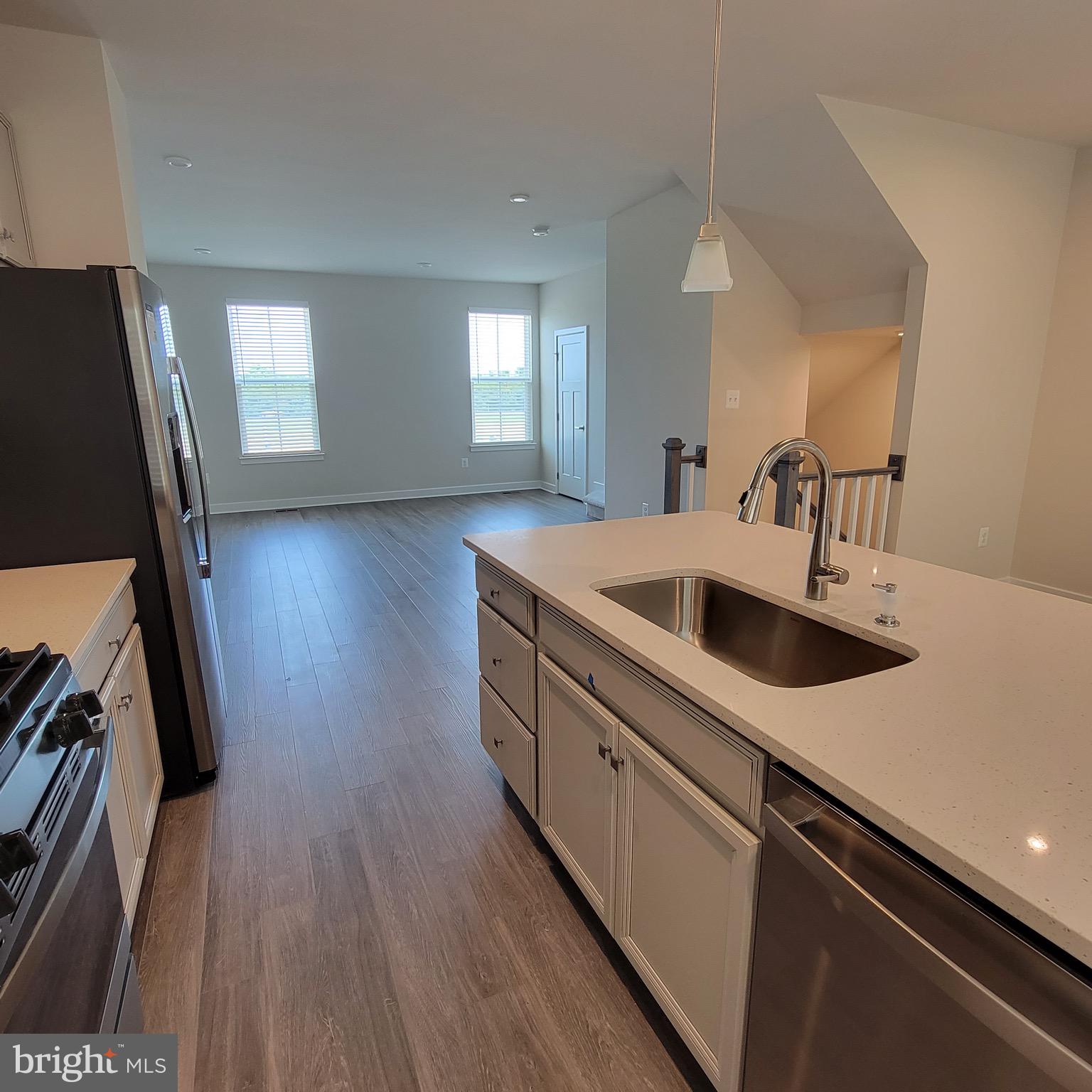 140 Fletcher Circle Middletown, DE 19709 - Photo 11 of 36 a kitchen with sink cabinets and wooden floor