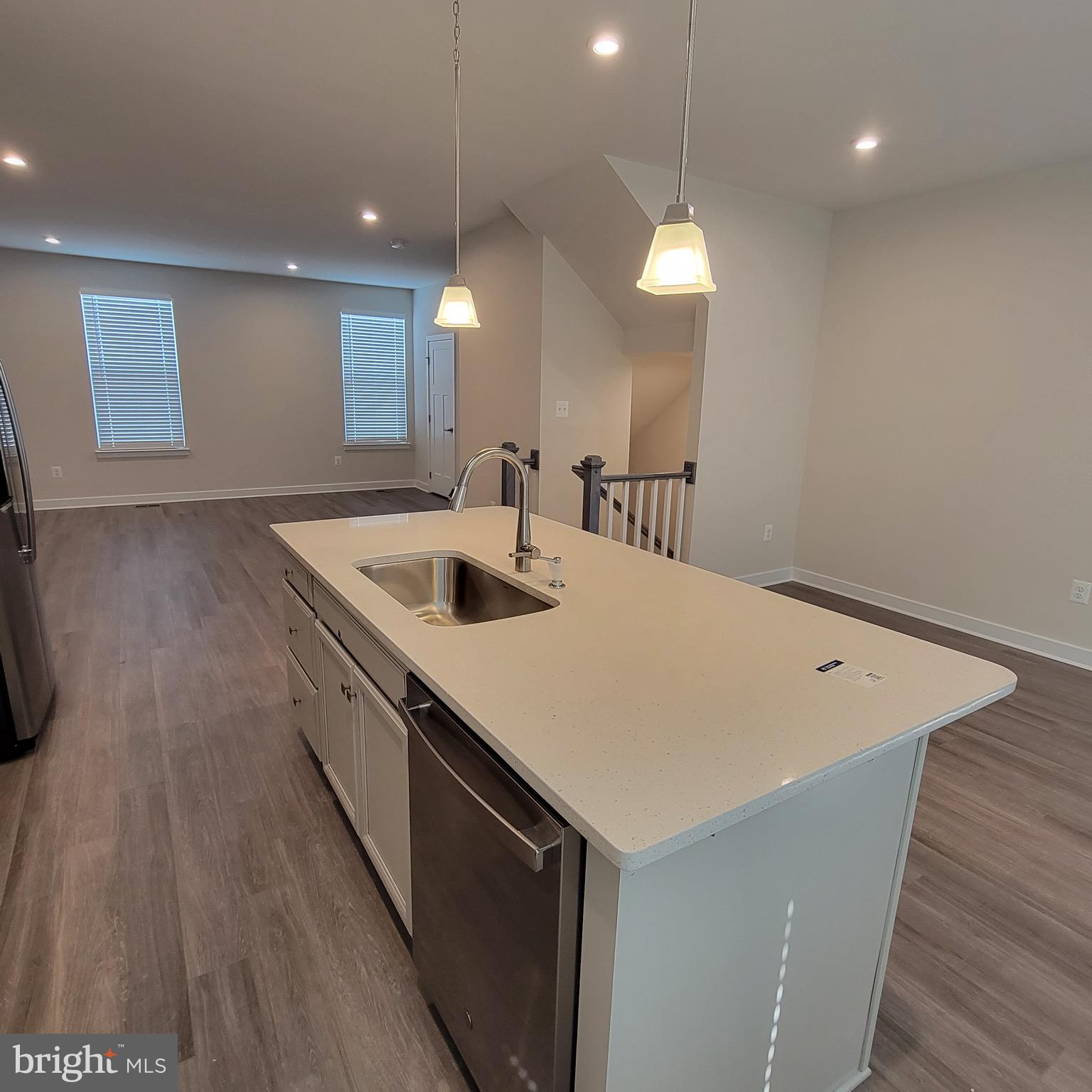 140 Fletcher Circle Middletown, DE 19709 - Photo 12 of 36 a kitchen with a sink and dishwasher with wooden floor