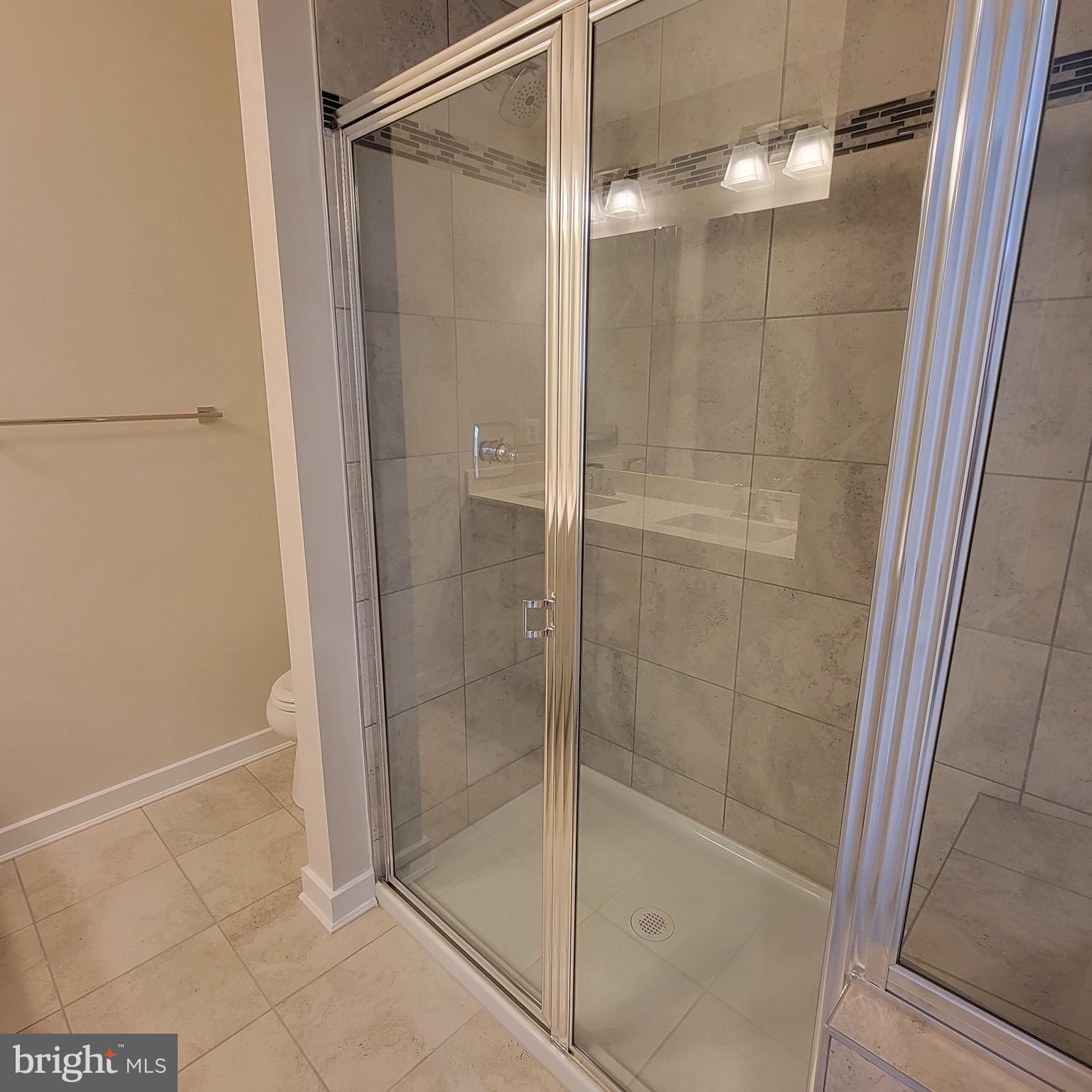 140 Fletcher Circle Middletown, DE 19709 - Photo 19 of 36 a bathroom with a glass shower door