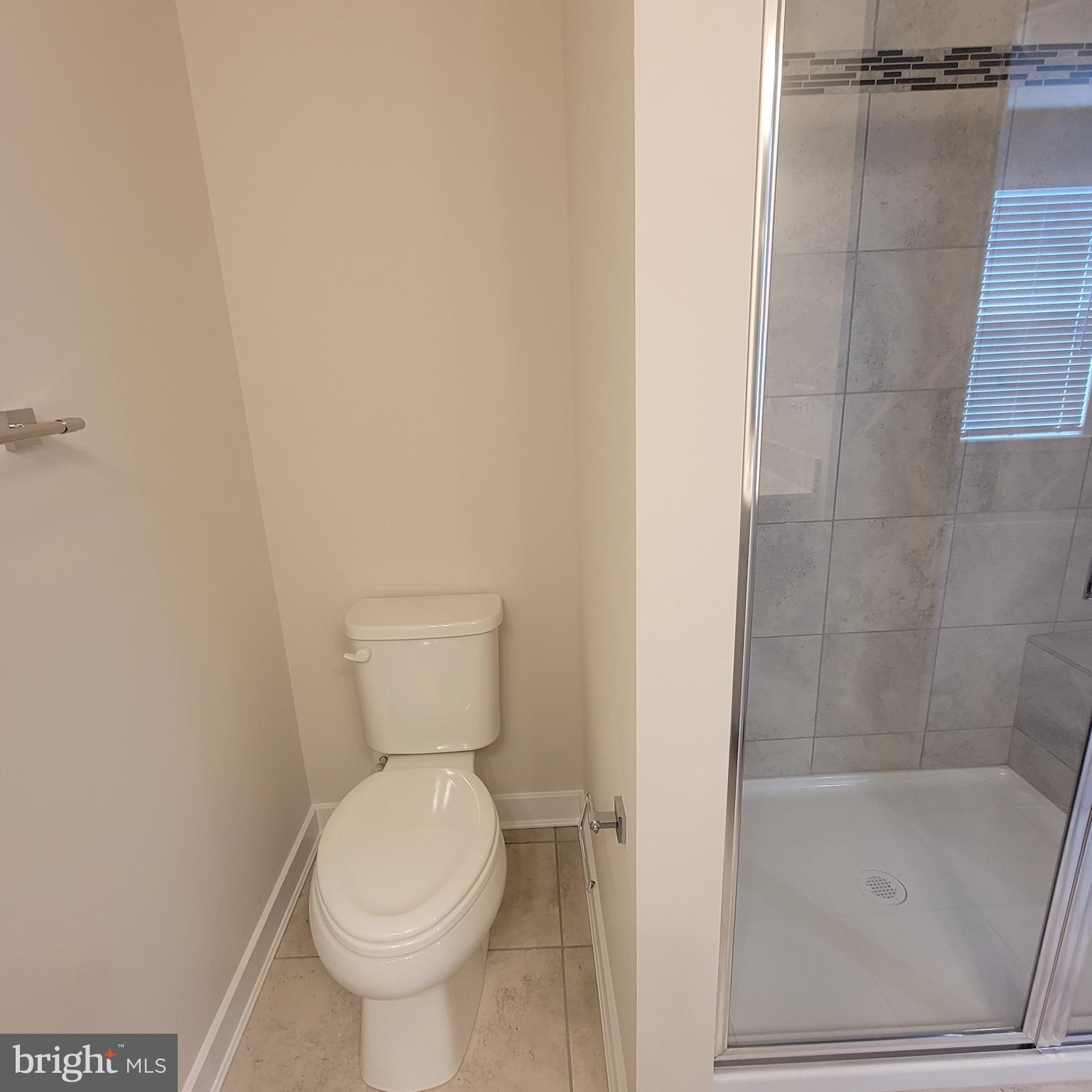 140 Fletcher Circle Middletown, DE 19709 - Photo 21 of 36 a bathroom with a toilet and a shower