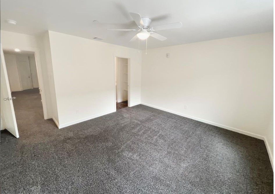 21155 Gosling Road, Unit 47B Spring, TX 77388 - Photo 16 of 29 an empty room with a ceiling fan and a window
