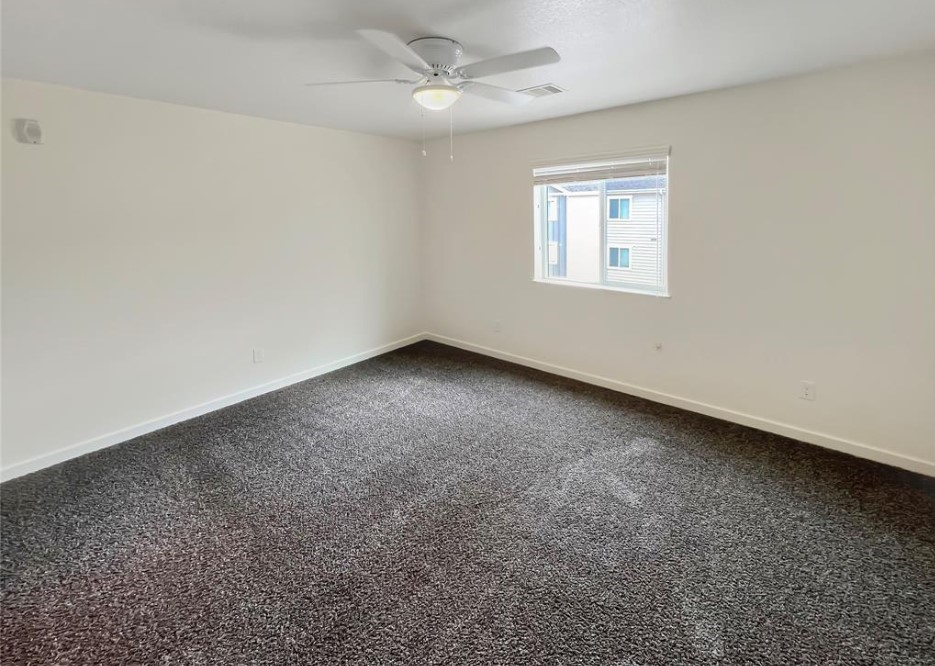 21155 Gosling Road, Unit 47B Spring, TX 77388 - Photo 17 of 29 an empty room with a window and a ceiling fan