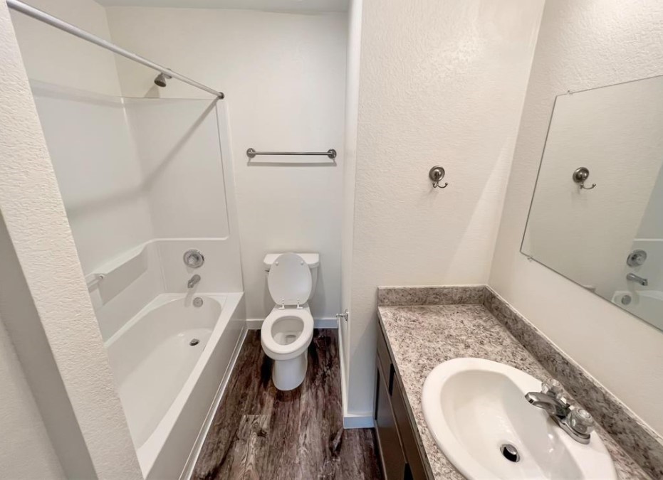 21155 Gosling Road, Unit 47B Spring, TX 77388 - Photo 19 of 29 a bathroom with a granite countertop sink toilet and shower