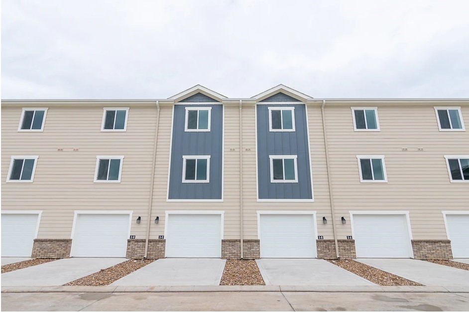 21155 Gosling Road, Unit 47B Spring, TX 77388 - Photo 2 of 29 a front view of a house with a yard and garage