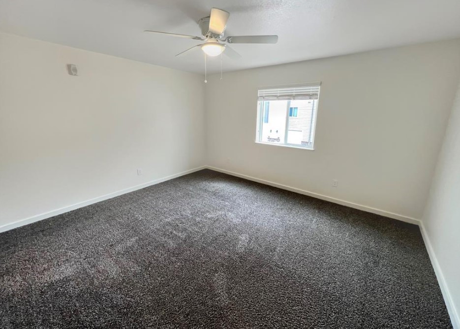 21155 Gosling Road, Unit 47B Spring, TX 77388 - Photo 22 of 29 an empty room with a window and a ceiling fan