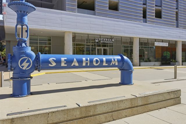 a view of front door of house with outdoor seating
