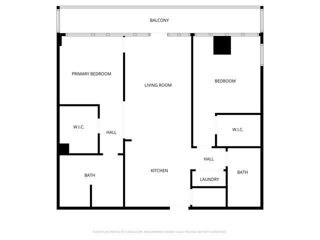 a picture of a bathroom with a white wall