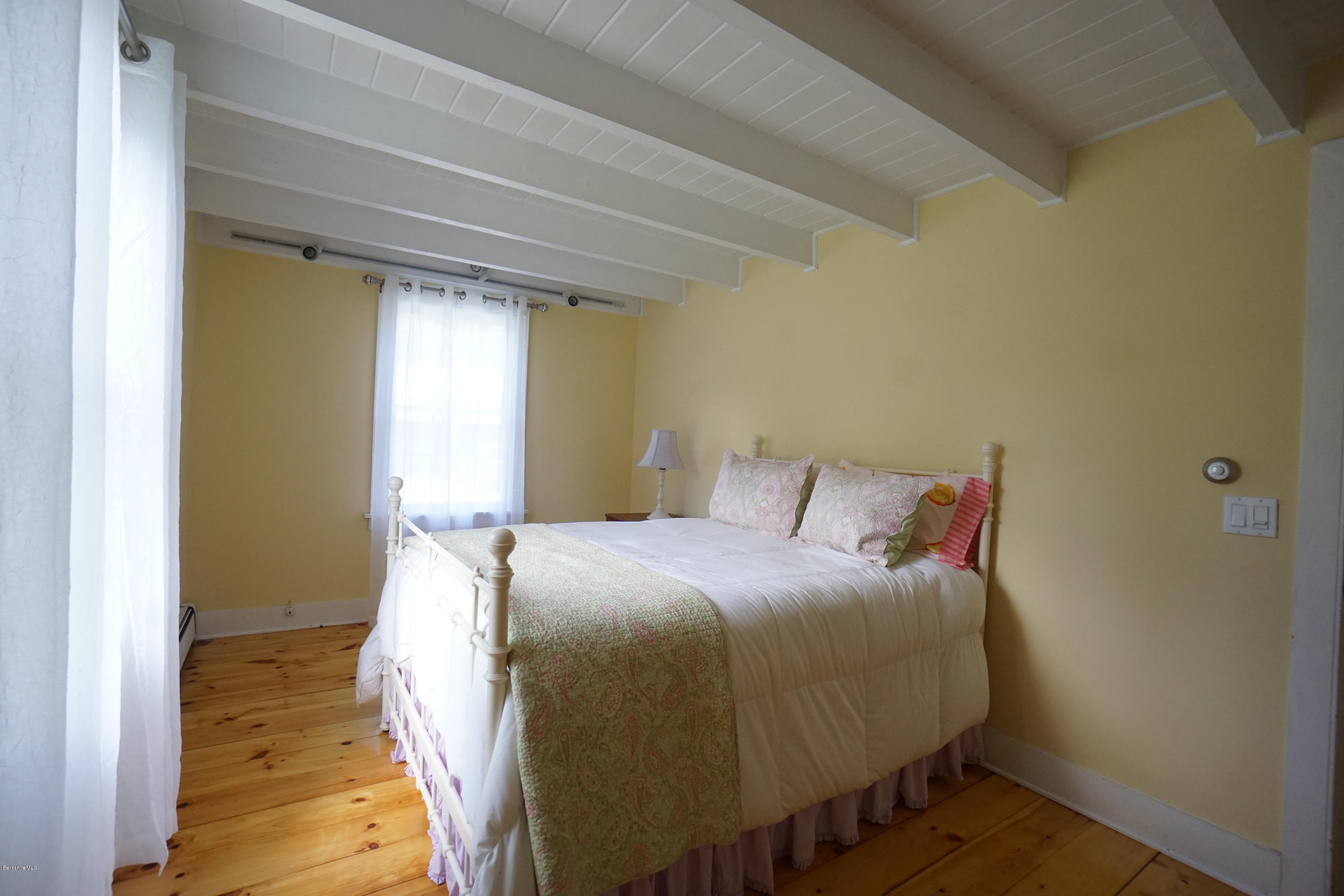 408 Summit Road Richmond, MA 01254 - Photo 17 of 36 a bedroom with a bed and wooden floor