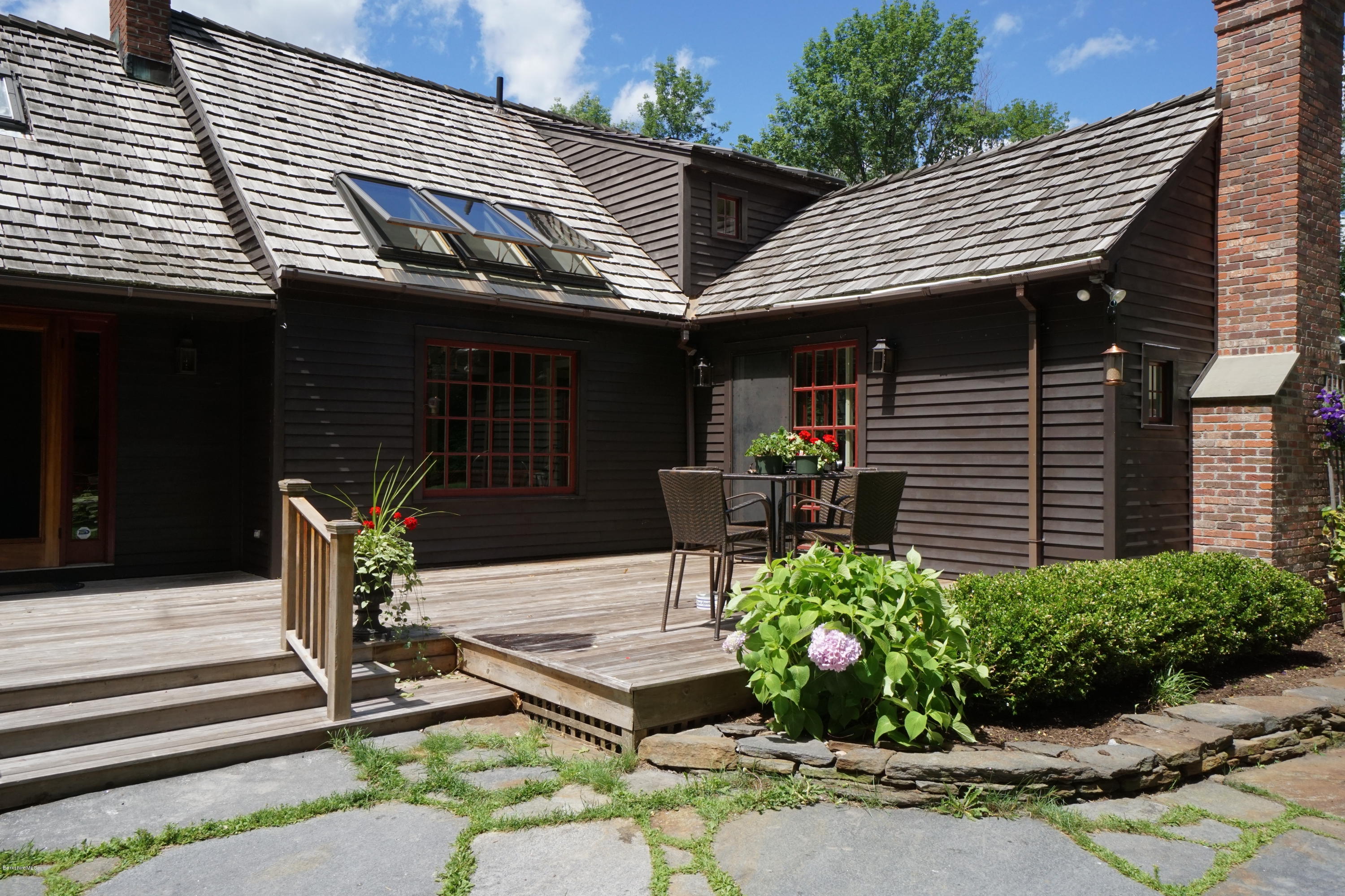 408 Summit Road Richmond, MA 01254 - Photo 3 of 36 a front view of a house with garden