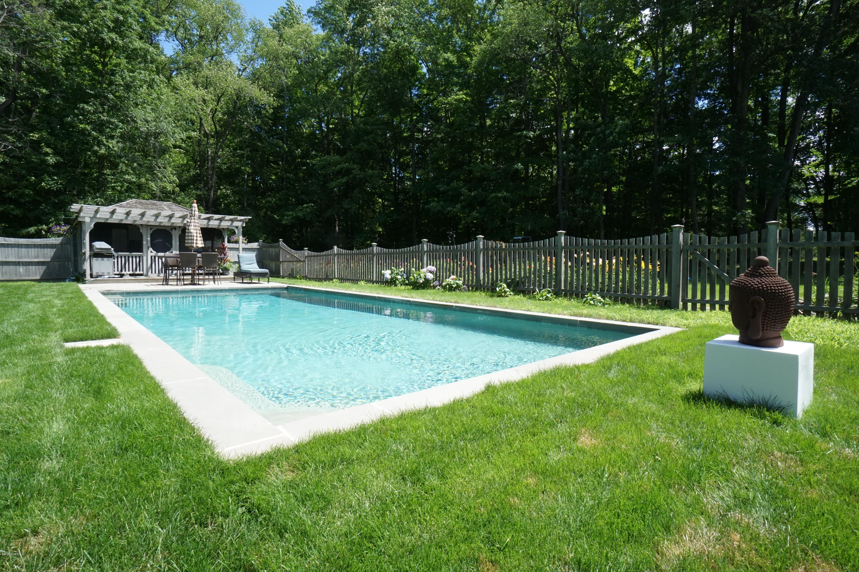 408 Summit Road Richmond, MA 01254 - Photo 4 of 36 a view of a swimming pool with a patio