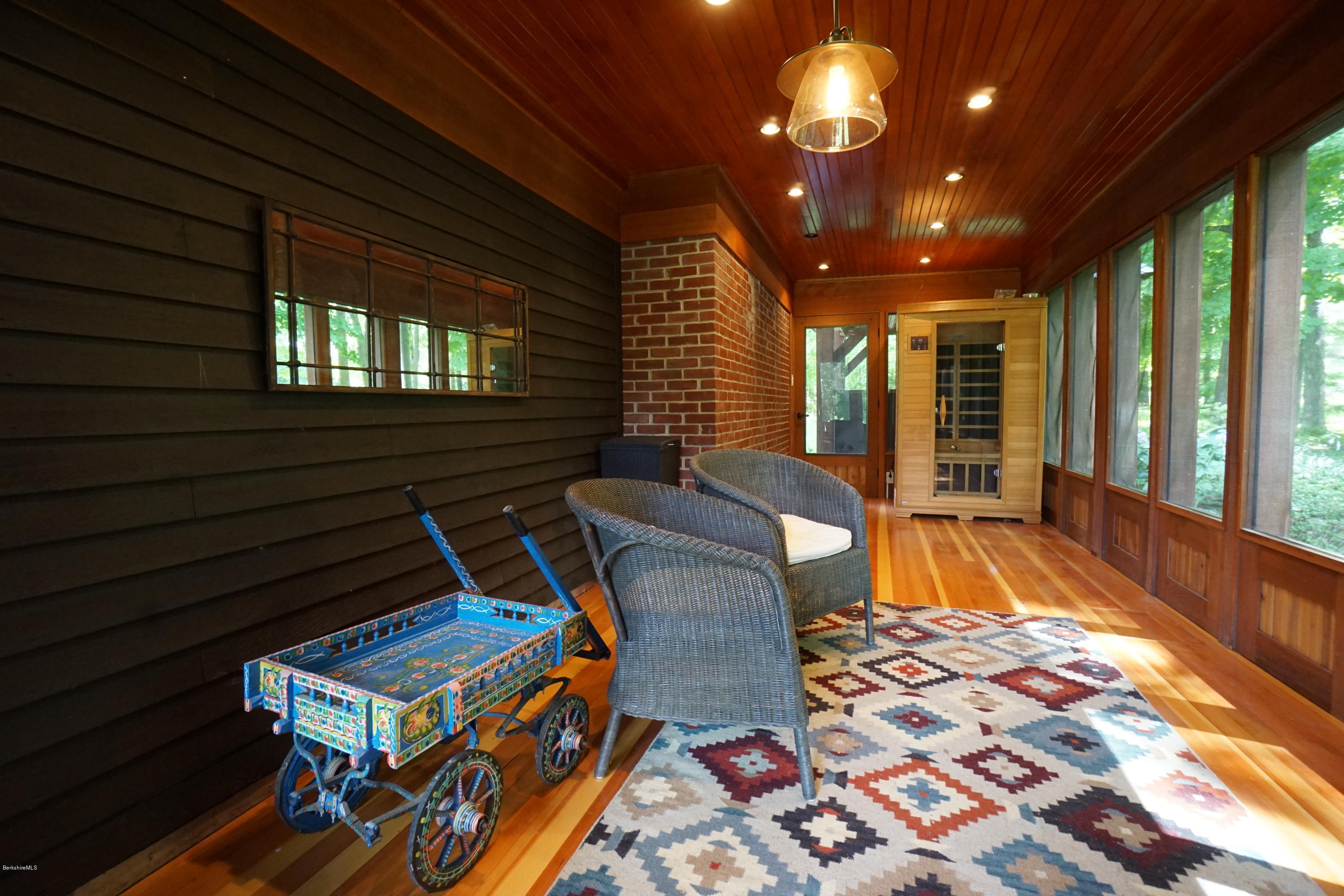 408 Summit Road Richmond, MA 01254 - Photo 36 of 36 a view of a patio with a dining table and chairs with wooden floor