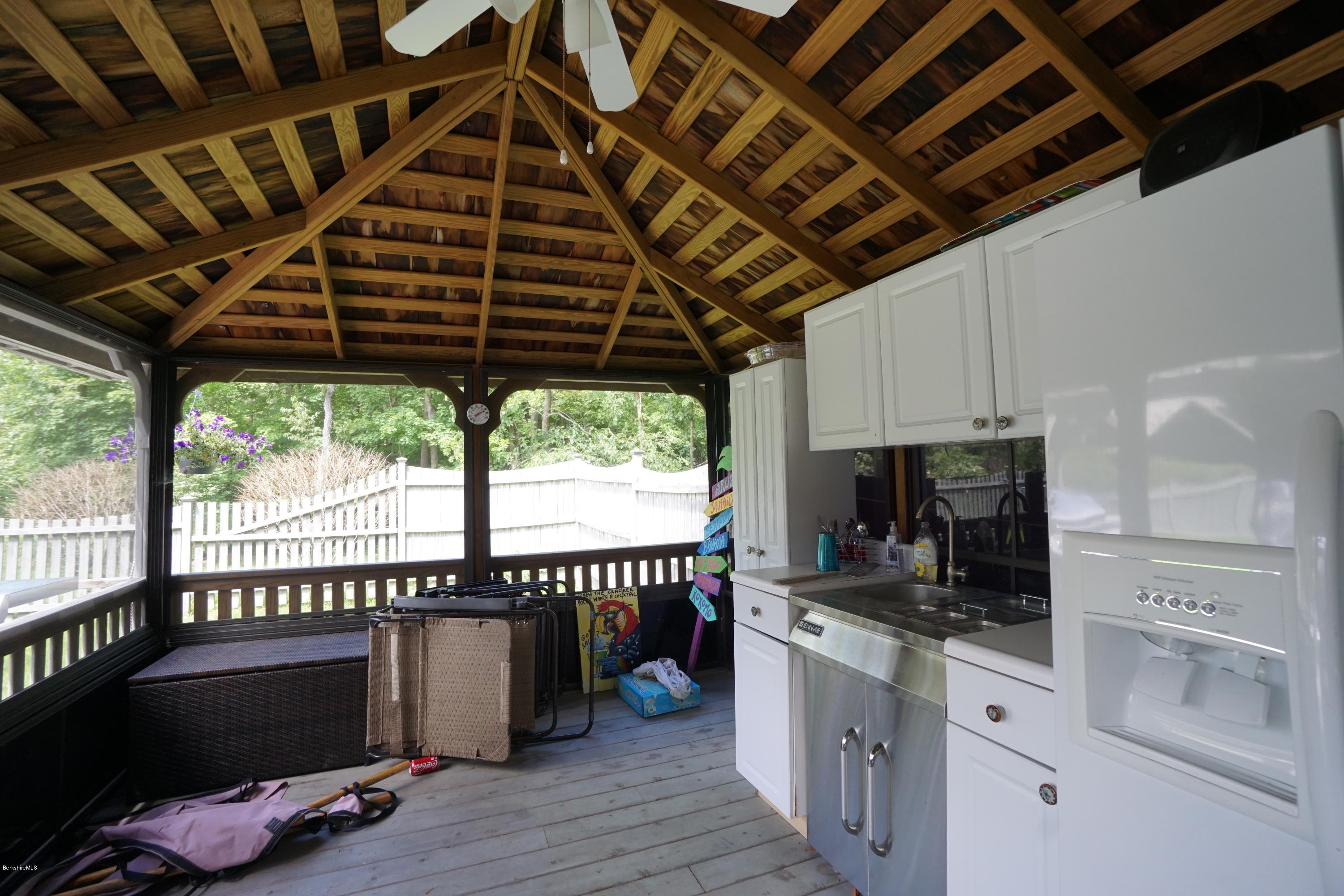 408 Summit Road Richmond, MA 01254 - Photo 6 of 36 a kitchen with a stove a refrigerator and wooden cabinets