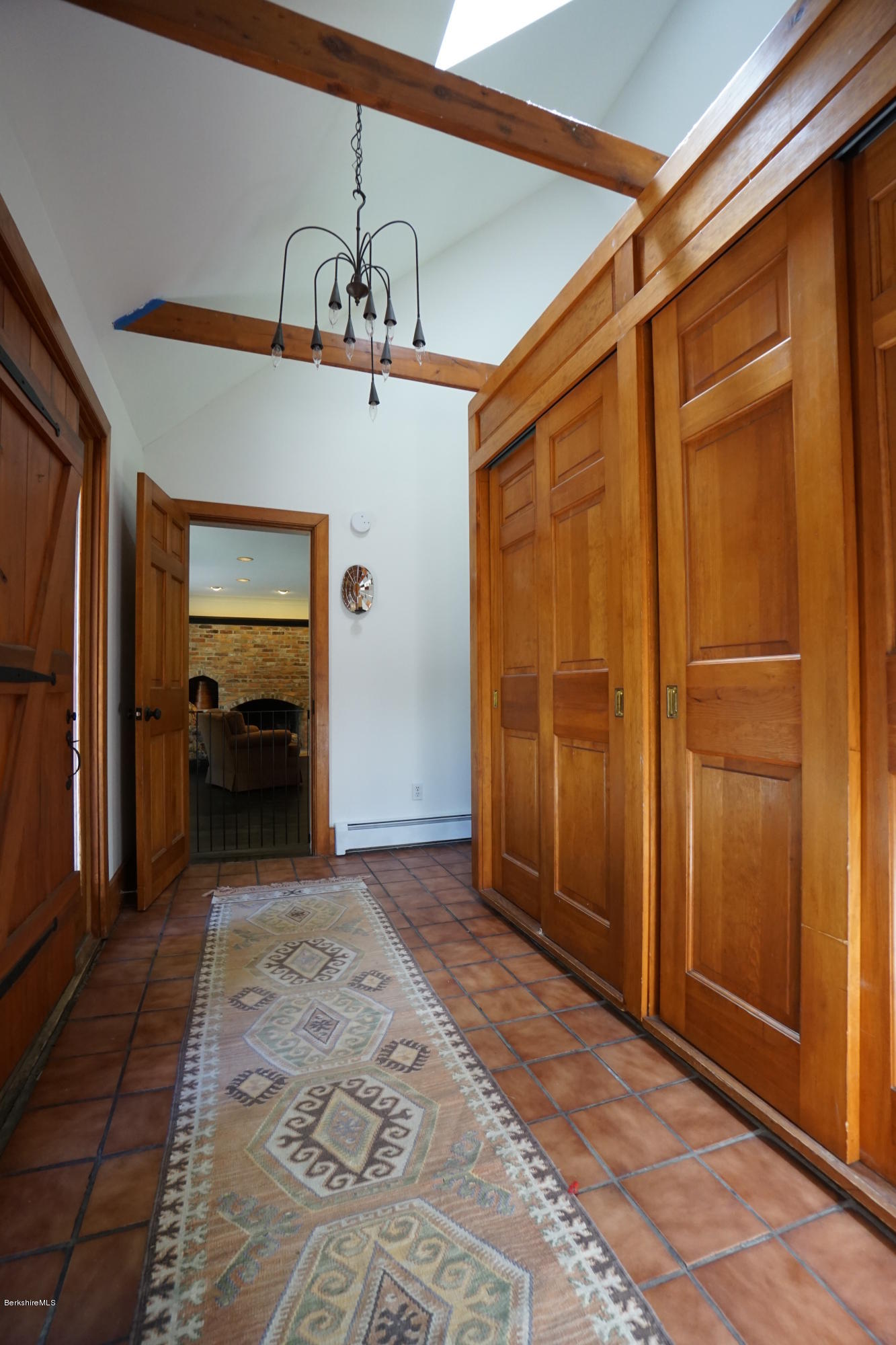 408 Summit Road Richmond, MA 01254 - Photo 8 of 36 a view of a hallway with a chandelier